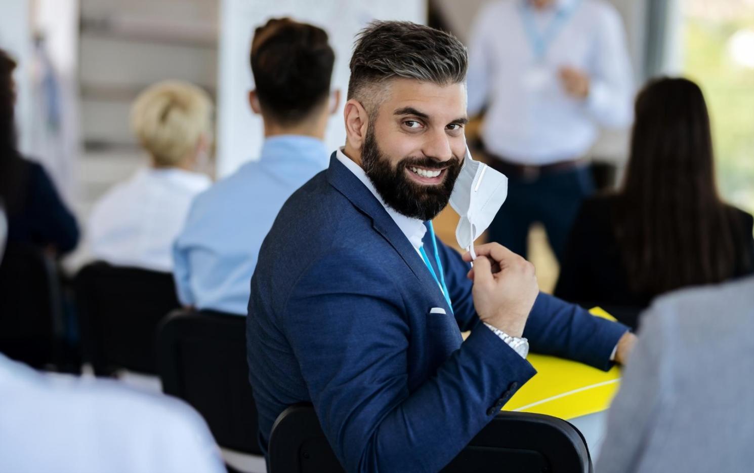 Individual study setup with multiple screens displaying budget tracking tools and learning materials